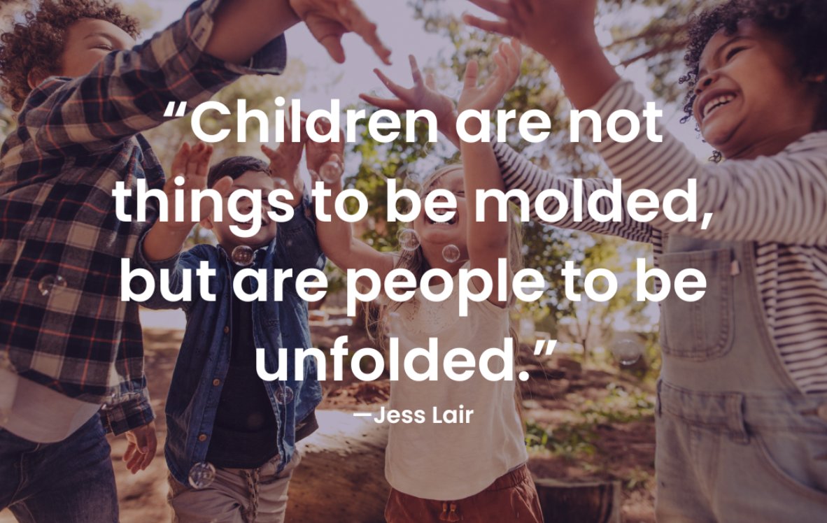 A quote in front of children that says "Children are not things to be molded but are people to be unfolded"